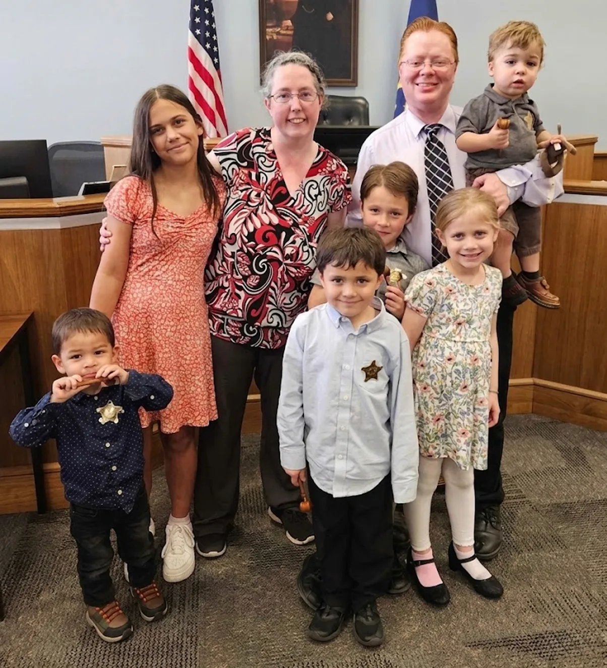 Jason Westover and family on adoption day in the courthouse — the reason behind everything he builds