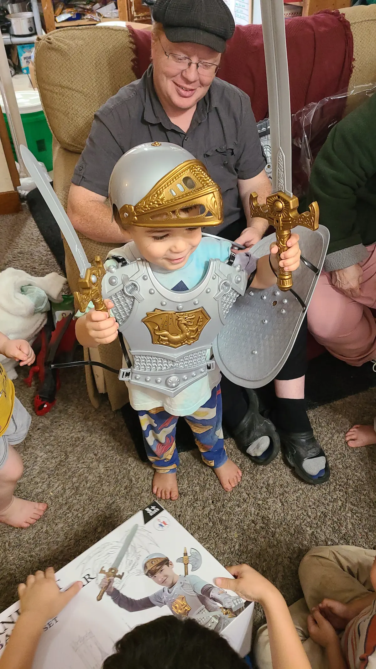 Z'kyan wearing his birthday knight armor, beaming with pride — the same hero spirit Jason teaches